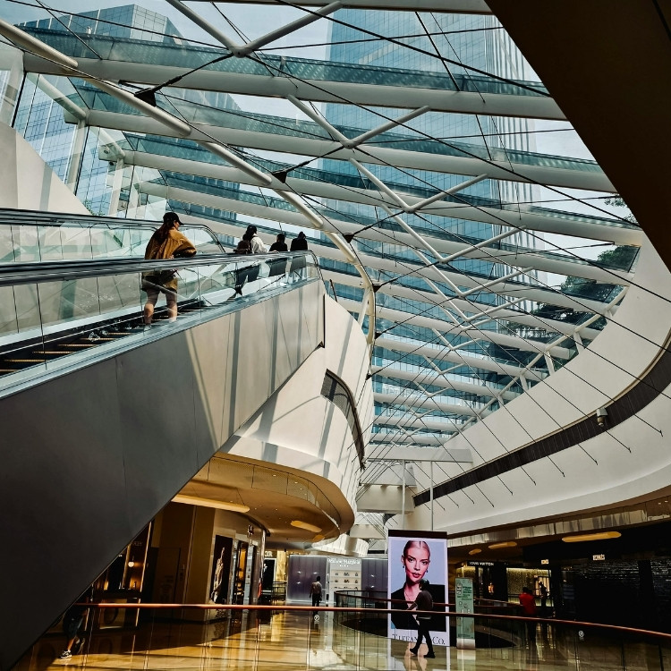 Modern retail atrium with security presence